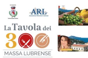 “Cena gourmet all’aperto durante l’evento La Tavola dei 300 a Massa Centro con ospiti e luci serali”